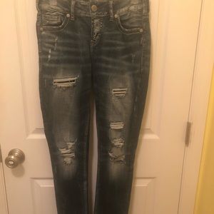 Distressed silver jeans